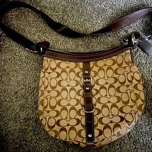 Women’s coach brown and white Crossbody bag slightly used in great condition